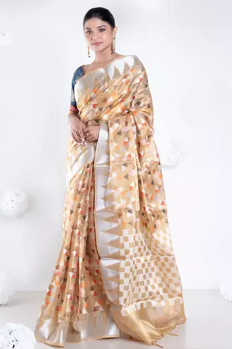 Banarasi kora organza saree in mud yellow color with multicolor motifs with copper zari
