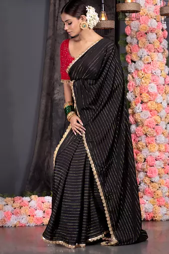 Black georgette saree with lurex gold stripes and scallop embroidered border