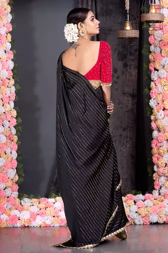 Black georgette saree with lurex gold stripes and scallop embroidered border