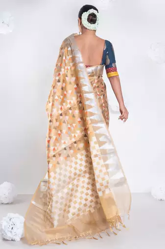 Banarasi kora organza saree in mud yellow color with multicolor motifs with copper zari