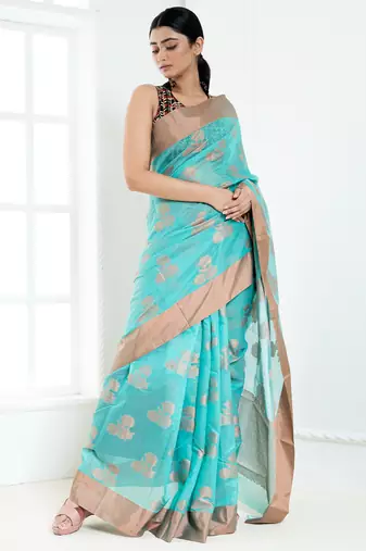 Ice blue banarasi cotton silk saree with floral motifs in antique copper gold zari