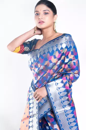 Banarasi kora organza saree in navy blue color with multicolor motifs with copper zari