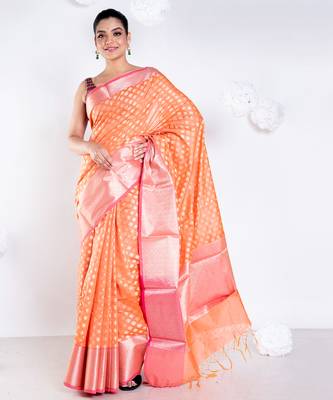 Banarasi kora organza saree in sunset orange color with golden border and booti 1