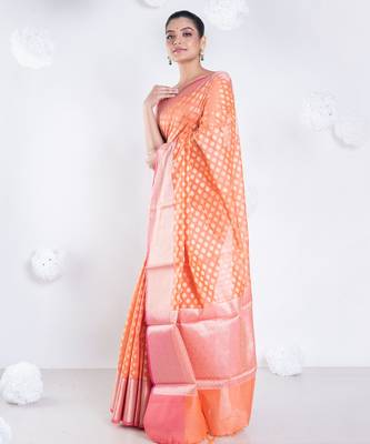 Banarasi kora organza saree in sunset orange color with golden border and booti 2