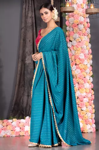 TEAL BLUE GEORGETTE SAREE WITH LUREX GOLD STRIPES AND SCALLOP EMBROIDERED BORDER
