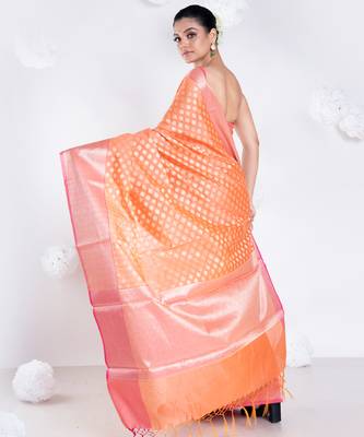 Banarasi kora organza saree in sunset orange color with golden border and booti 3
