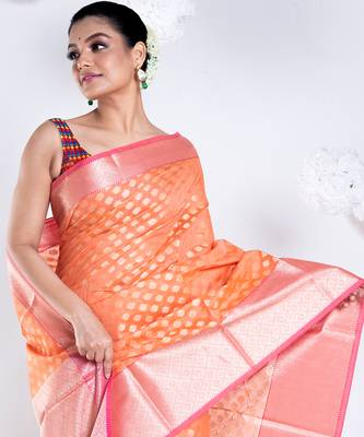 Banarasi kora organza saree in sunset orange color with golden border and booti 4