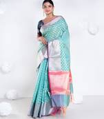 Banarasi kora organza saree in green color with golden border and booti