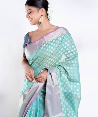 Banarasi kora organza saree in green color with golden border and booti 2