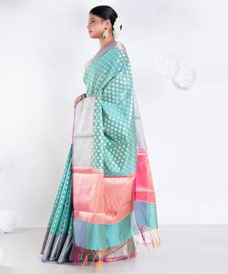 Banarasi kora organza saree in green color with golden border and booti 3