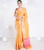 Banarasi kora organza saree in orange color with golden booti and border