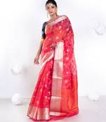 Banarasi kora cotton saree in sunset red color with floral jaal and golden border