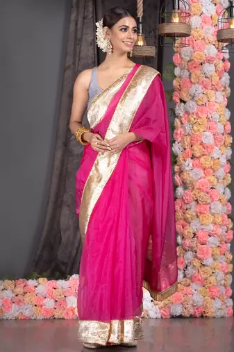 Hot pink organza saree with gold gota border and fringe lace