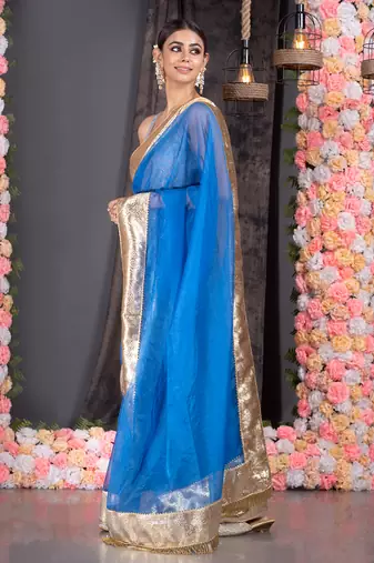 Royal blue organza saree with gold gota border and fringe lace