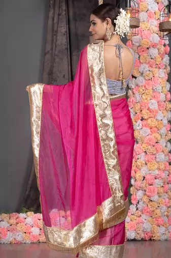 Hot pink organza saree with gold gota border and fringe lace