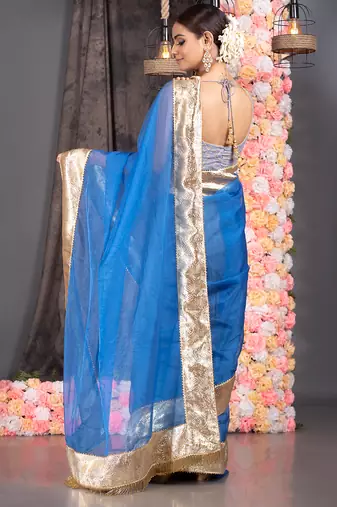 Royal blue organza saree with gold gota border and fringe lace