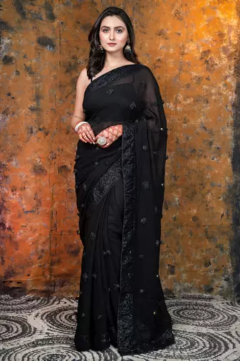 Black Georgette saree with sequin border and handmade rosette