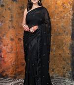 Black Georgette saree with sequin border and handmade rosette