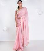 Pink color Georgette saree with golden embroidered border