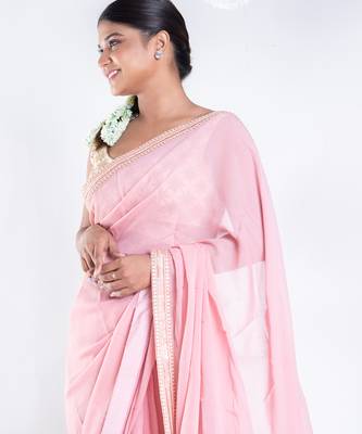 Pink color Georgette saree with golden embroidered border 2