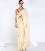 Beige color Georgette saree with golden embroidered border