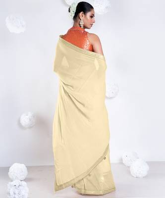 Beige color Georgette saree with golden embroidered border 4