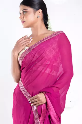 Georgette saree with pink color with golden embroidered border
