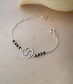 Rhodium-plated swastik black beads nazariya bracelet