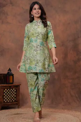 A green digital flower printed muslin party wear coord sets