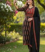 black and red paisley printed kurti set with a dupatta.