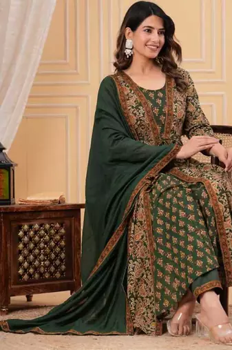 green printed anarkali kurta set with a matching dupatta and pants.
