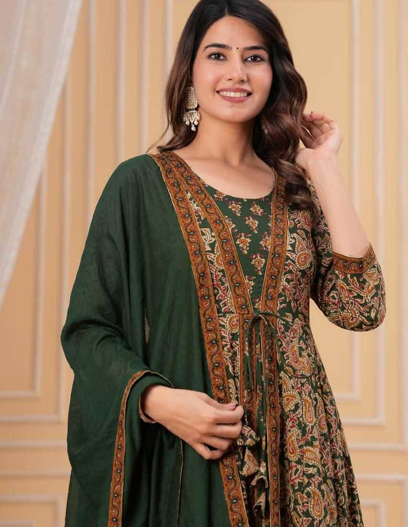 green printed anarkali kurta set with a matching dupatta and pants.