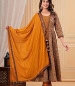 mustard yellow paisley printed anarkali kurta set with trousers and a dupatta.