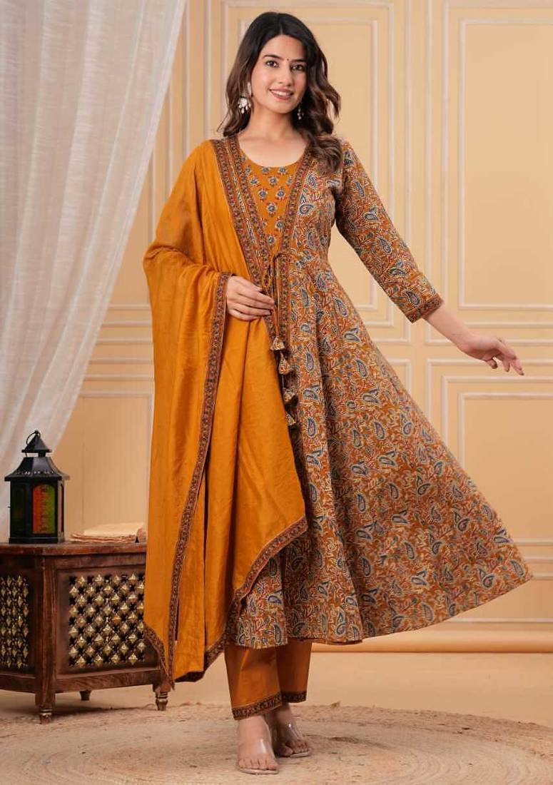 mustard yellow paisley printed anarkali kurta set with trousers and a dupatta.