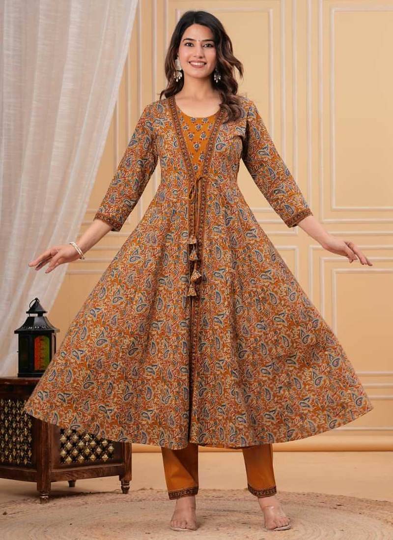 mustard yellow paisley printed anarkali kurta set with trousers and a dupatta.