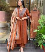 rust orange cotton kurta set with a block-printed dupatta and pants,