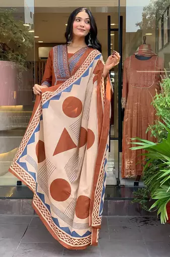 rust orange cotton kurta set with a block-printed dupatta and pants,