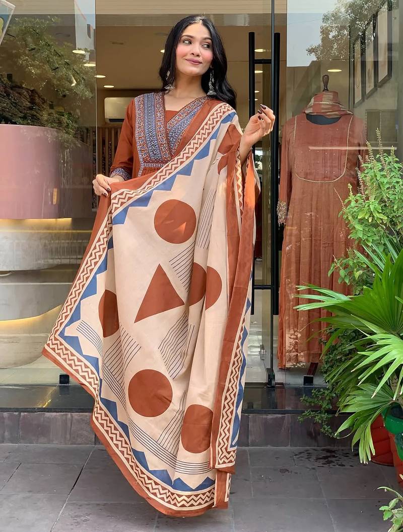 rust orange cotton kurta set with a block-printed dupatta and pants,