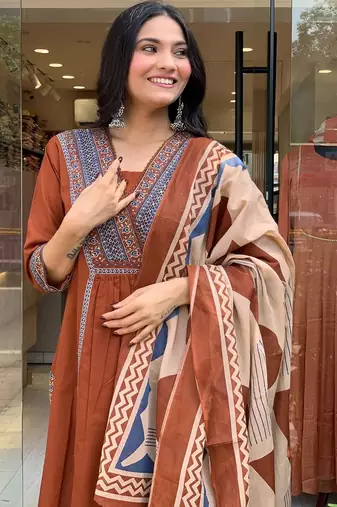 rust orange cotton kurta set with a block-printed dupatta and pants,
