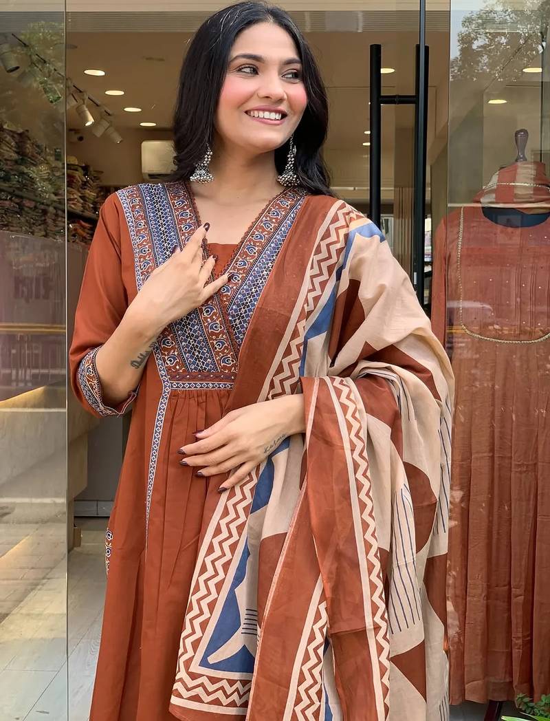 rust orange cotton kurta set with a block-printed dupatta and pants,