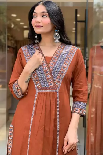 rust orange cotton kurta set with a block-printed dupatta and pants,
