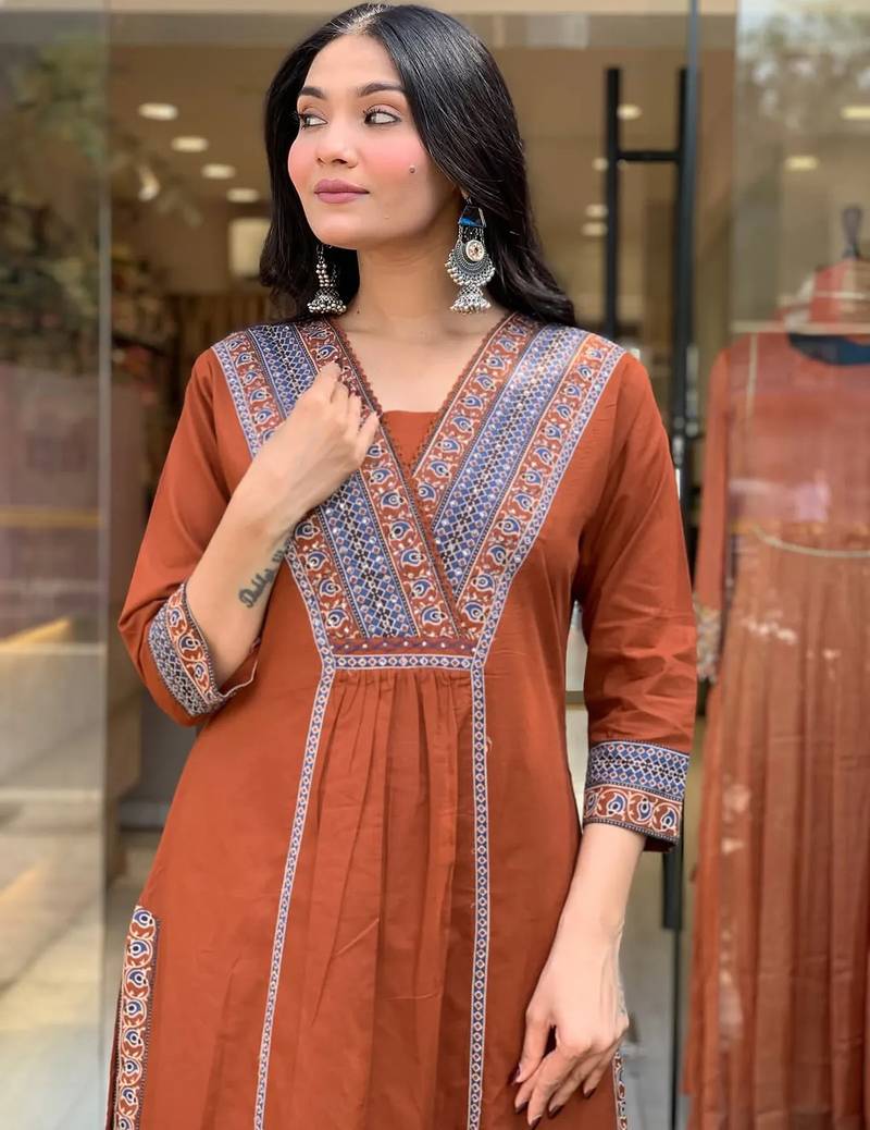 rust orange cotton kurta set with a block-printed dupatta and pants,