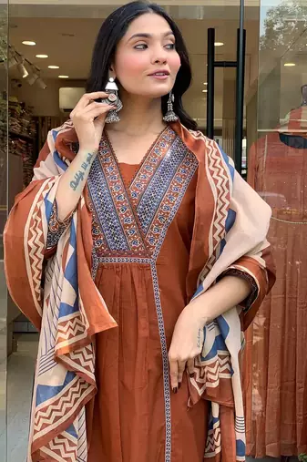rust orange cotton kurta set with a block-printed dupatta and pants,