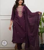 purple embroidered salwar kameez set with a dupatta.