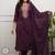 purple embroidered salwar kameez set with a dupatta.