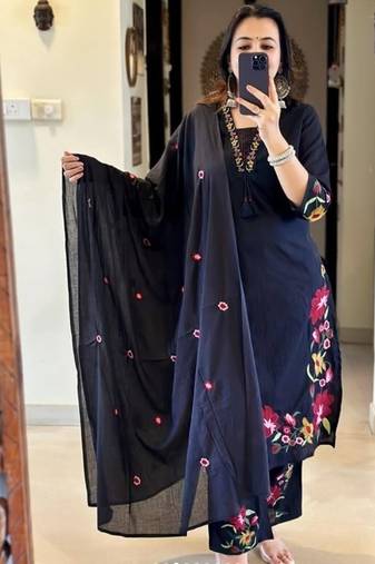 black salwar kameez suit with red and green floral embroidery.