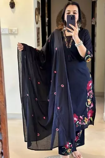 black salwar kameez suit with red and green floral embroidery.