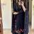 black salwar kameez suit with red and green floral embroidery.