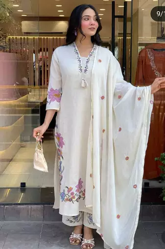 white linen floral embroidered kurta set.