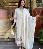 white linen floral embroidered kurta set.